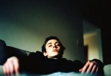 Sports News Analysis: Why These Wins and Losses Matter Exhausted man slouched on couch after game loss