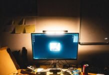 Tech News Roundup: Biggest Product Launches and Updates Messy desk with laptop, pizza, and late-night keynote glare