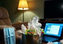 Health News Today: Medical Breakthroughs and Public Health Alerts Messy living room with overflowing tissue trash and flu meds