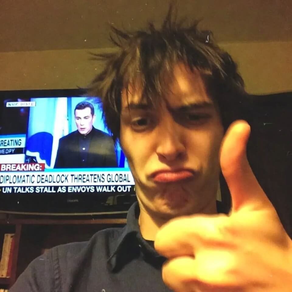 Sarcastic thumbs-up with "diplomatic deadlock" TV chyron