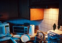 Health News Alert: Symptoms, Risks & Prevention Tips Cluttered late-night kitchen counter, dimly lit and tilted view